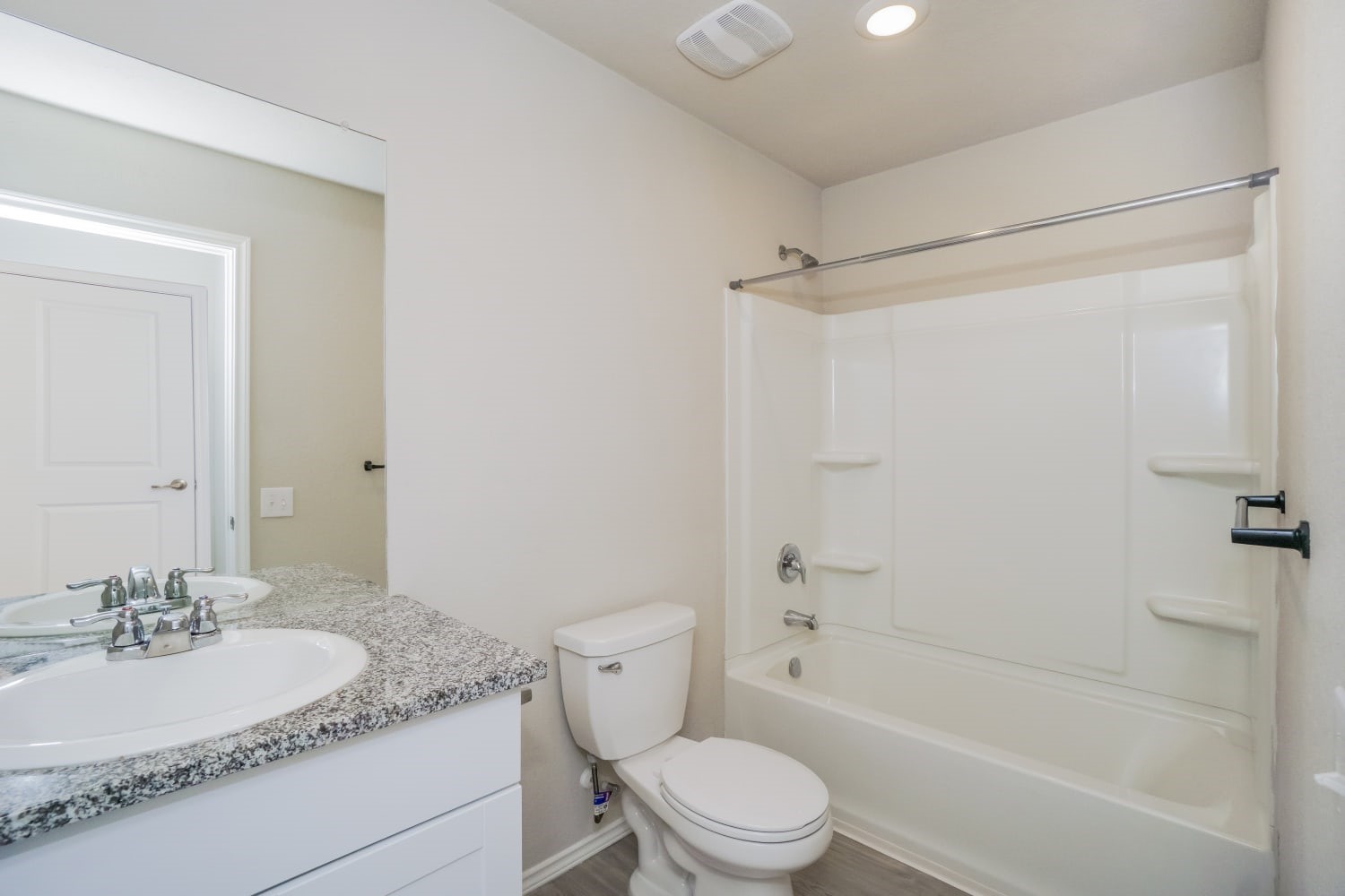 703 Vermilion San Antonio, TX 78221 - Photo 14 of 15 a bathroom with a granite countertop sink toilet and shower