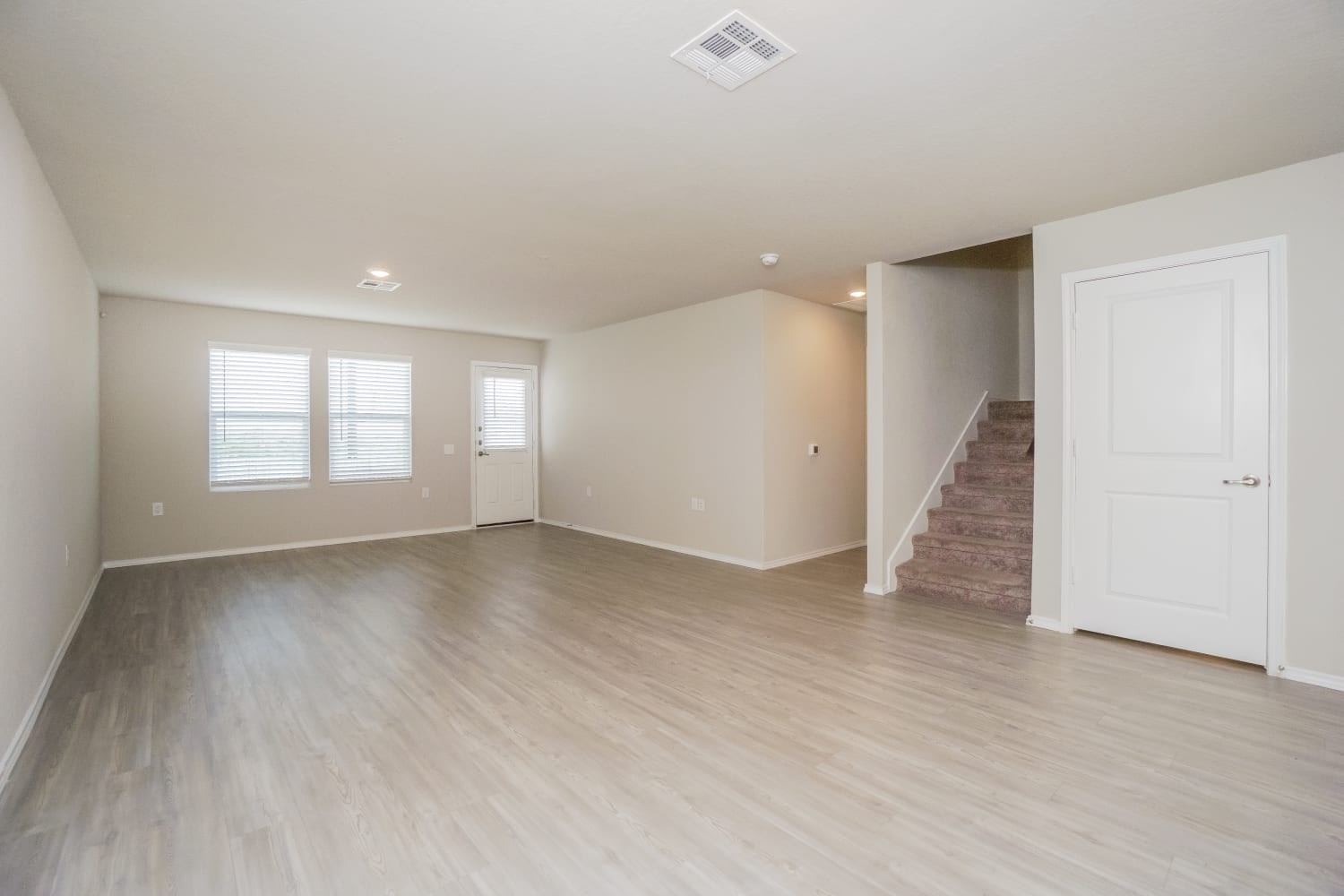 703 Vermilion San Antonio, TX 78221 - Photo 4 of 15 an empty room with wooden floor and windows