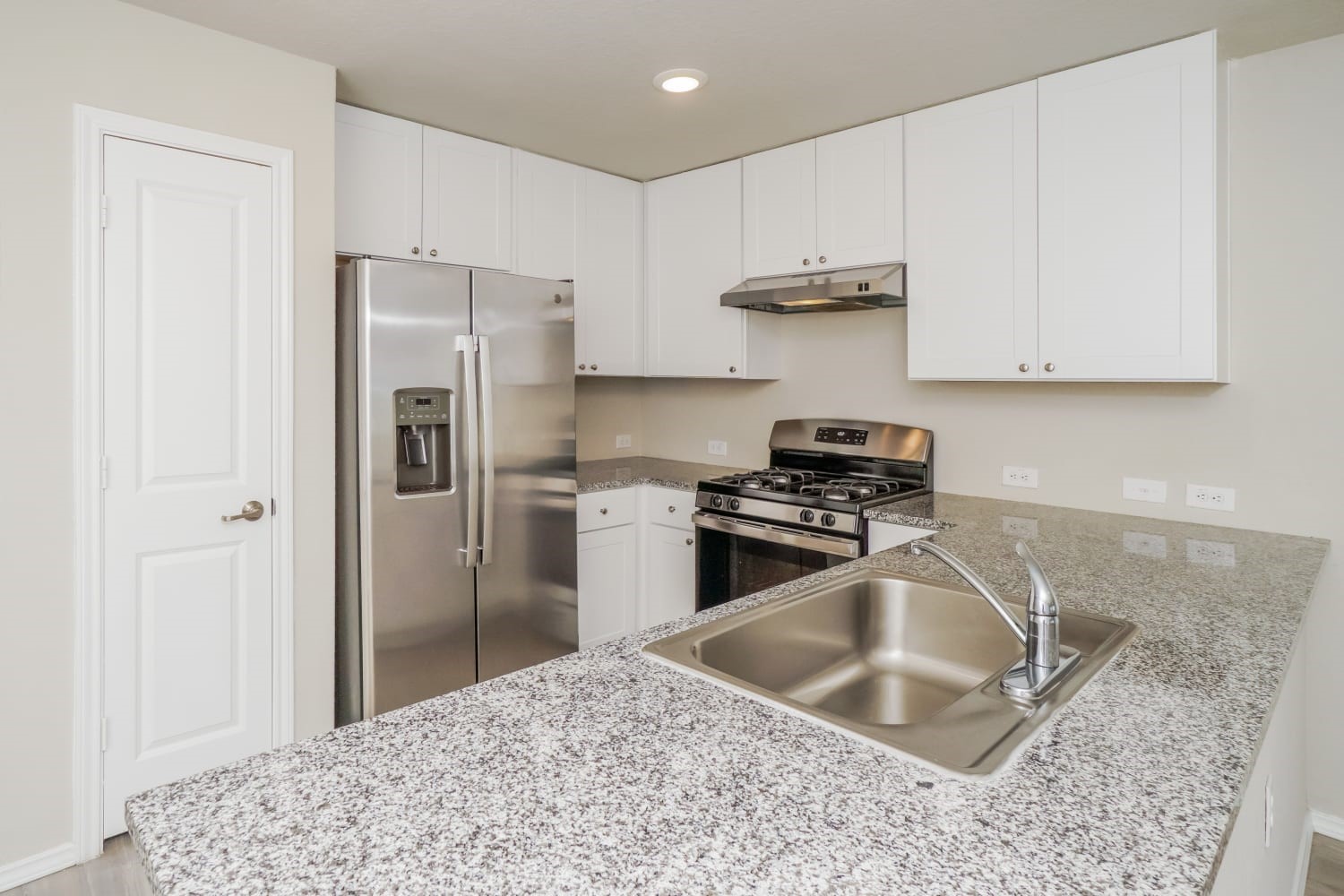 703 Vermilion San Antonio, TX 78221 - Photo 7 of 15 a kitchen with granite countertop a sink stove and refrigerator