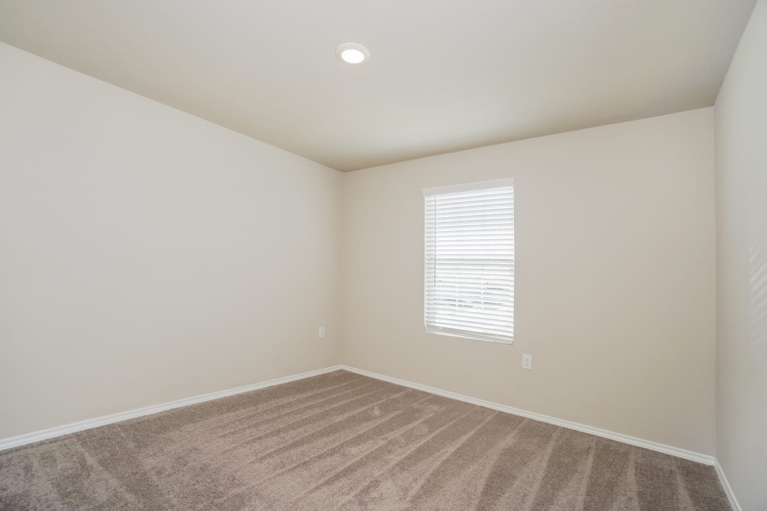 703 Vermilion San Antonio, TX 78221 - Photo 10 of 15 an empty room with wooden floor and windows
