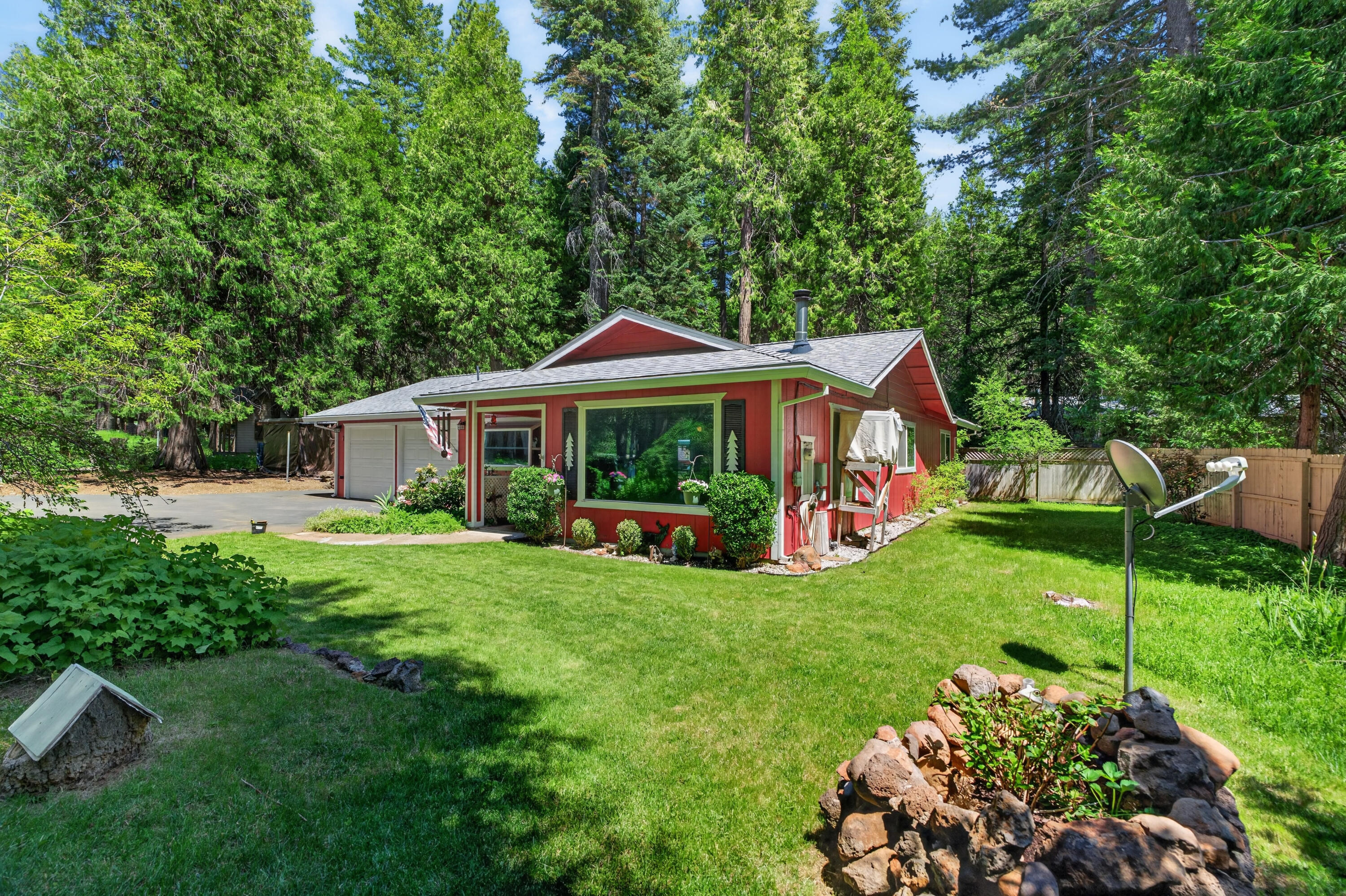 8015 Starlite Pines Road Shingletown, CA 96088 - Photo 5 of 38 a front view of a house with garden