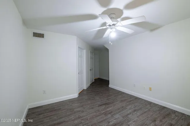 a bathroom with a granite countertop sink toilet a large mirror a vanity and shower