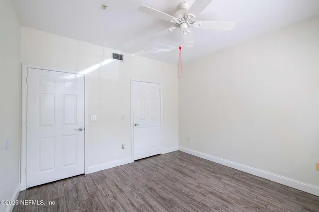 a view of a livingroom with a chandelier fan