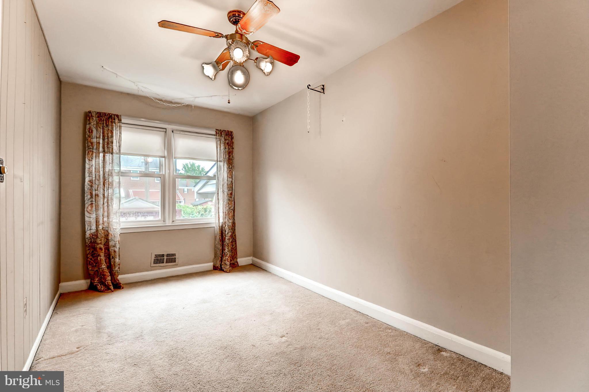 2102 Redthorn Road Baltimore, MD 21220 - Photo 14 of 30 an empty room with windows and fan