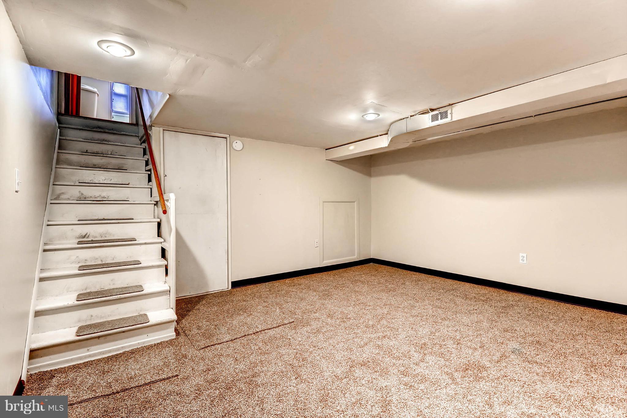 2102 Redthorn Road Baltimore, MD 21220 - Photo 23 of 30 a view of a room with stairs and a floor to ceiling window
