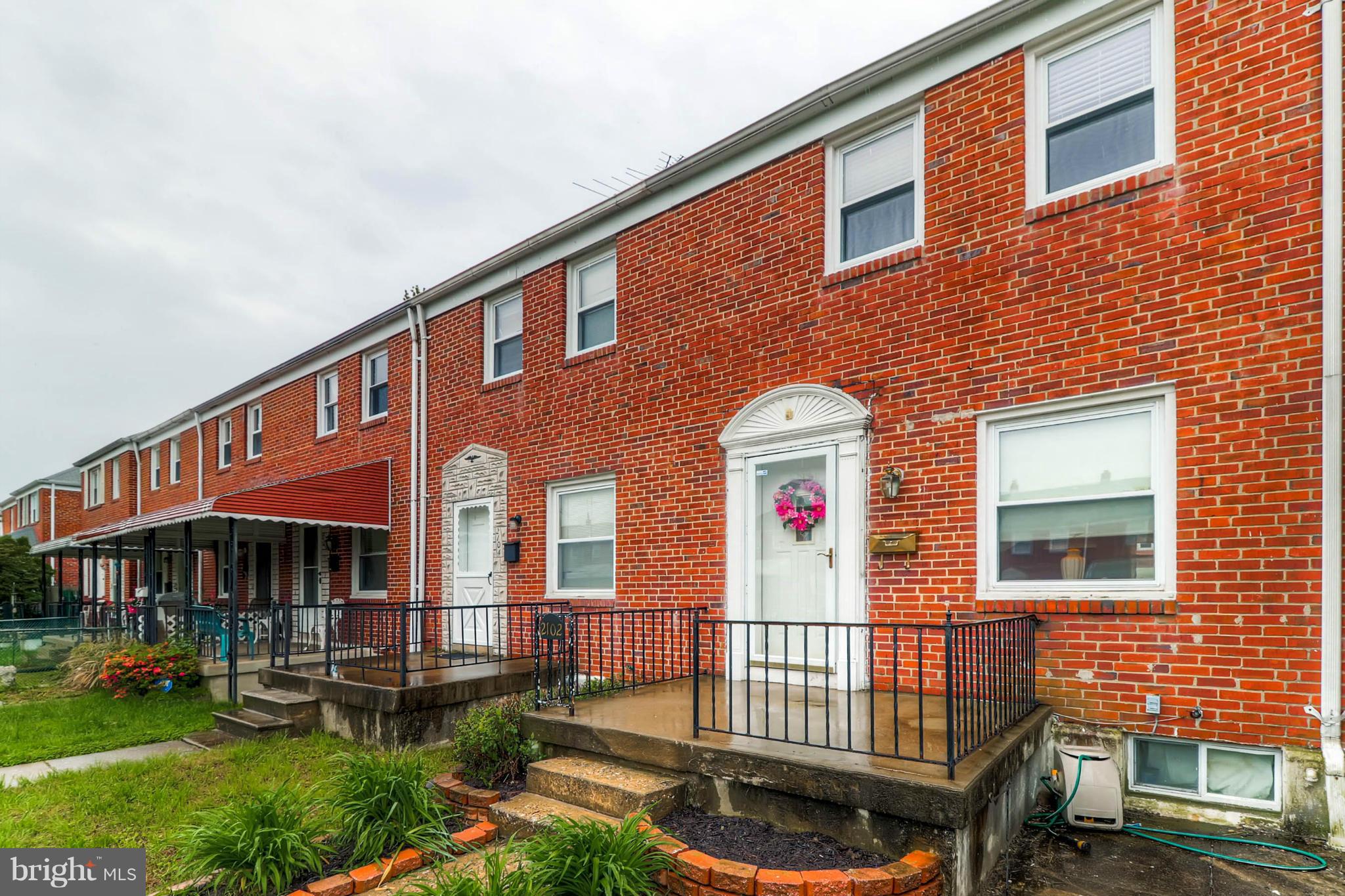 2102 Redthorn Road Baltimore, MD 21220 - Photo 6 of 30 a front view of a house with a yard