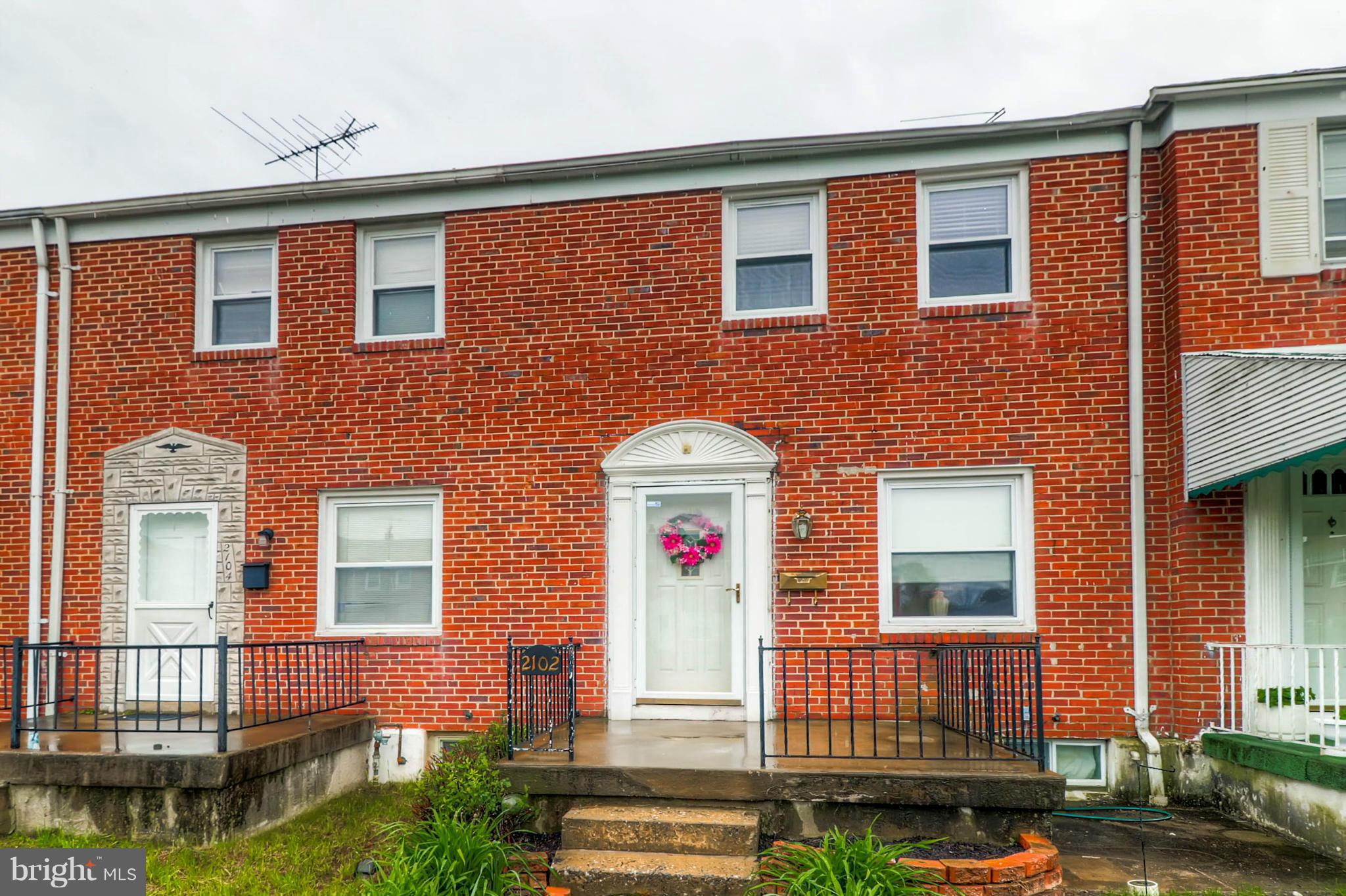2102 Redthorn Road Baltimore, MD 21220 - Photo 7 of 30 a front view of a house with a yard