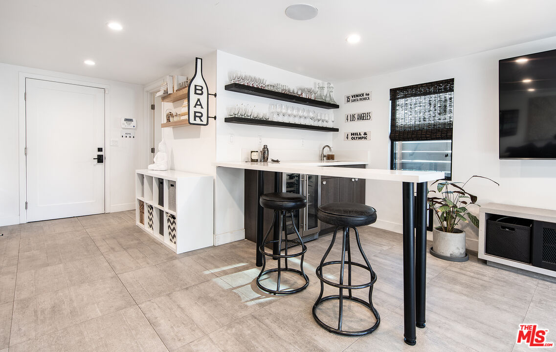 5317 Pacific Avenue Marina del Rey, CA 90292 - Photo 11 of 41 a kitchen with stainless steel appliances granite countertop a stove a sink and a refrigerator