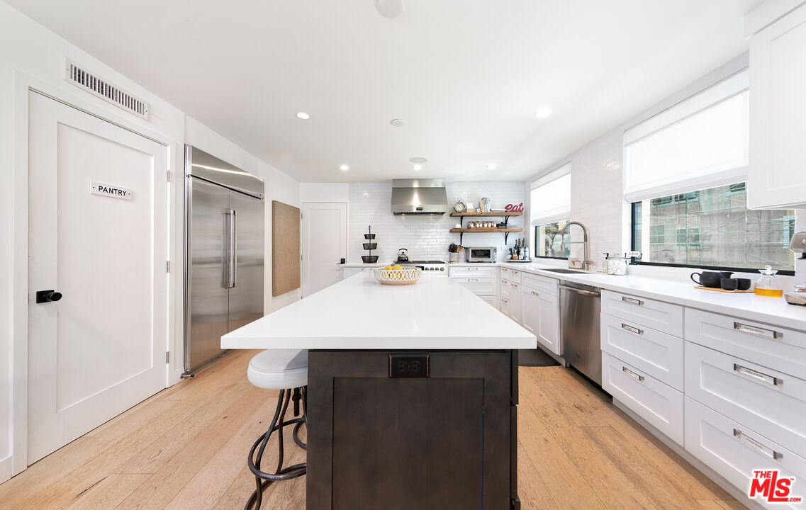 5317 Pacific Avenue Marina del Rey, CA 90292 - Photo 17 of 41 a large kitchen with a sink a refrigerator and a stove top oven