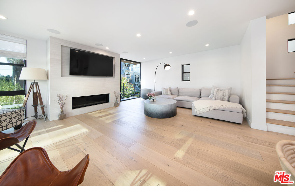 5317 Pacific Avenue Marina del Rey, CA 90292 - Photo 23 of 41 a living room with furniture and a flat screen tv