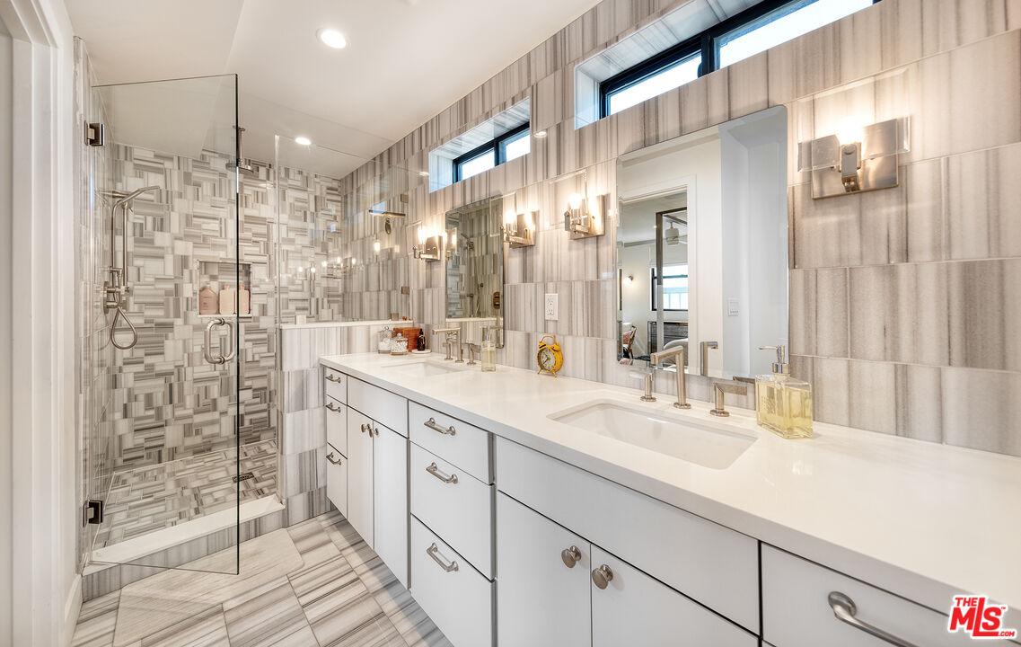 5317 Pacific Avenue Marina del Rey, CA 90292 - Photo 29 of 41 a bathroom with a double vanity sink mirror and shower