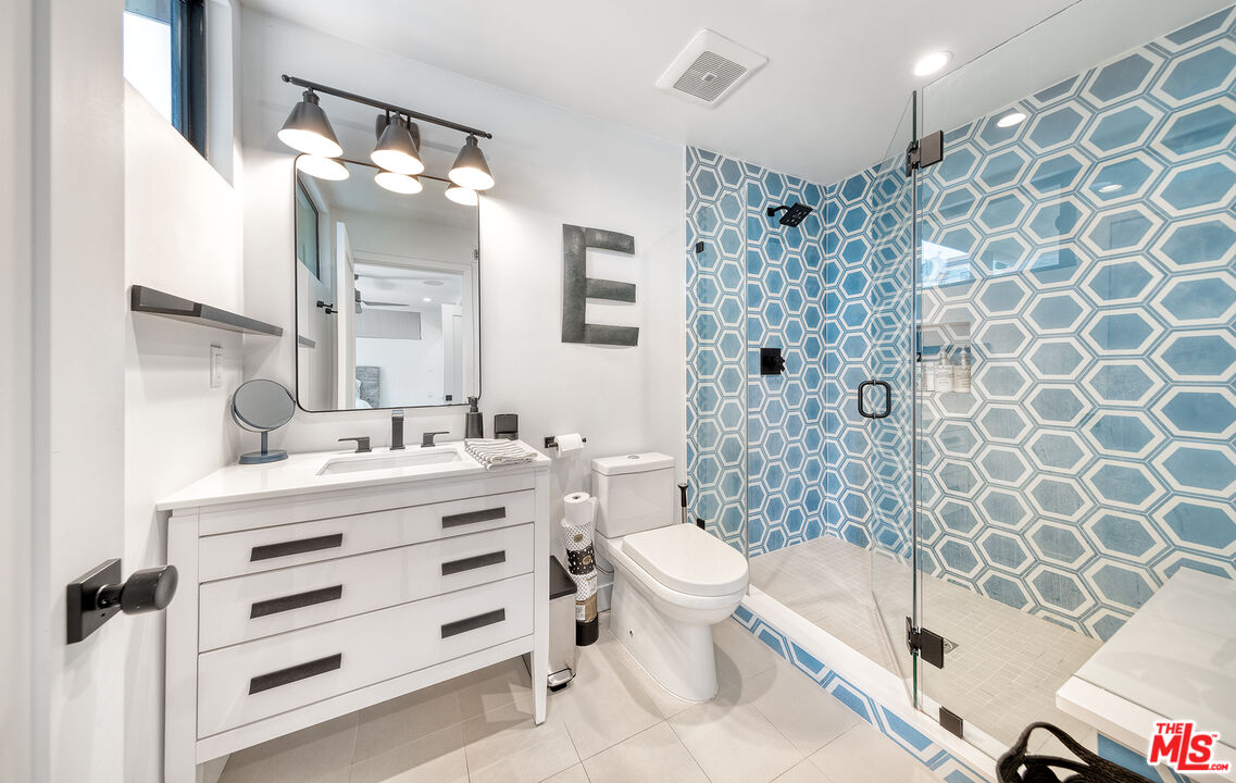 5317 Pacific Avenue Marina del Rey, CA 90292 - Photo 32 of 41 a bathroom with a bathtub sink mirror vanity and toilet