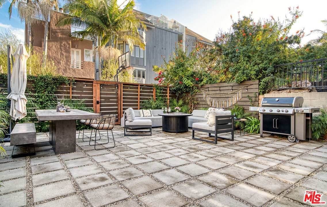 5317 Pacific Avenue Marina del Rey, CA 90292 - Photo 5 of 41 a view of a patio with table and chairs and potted plants