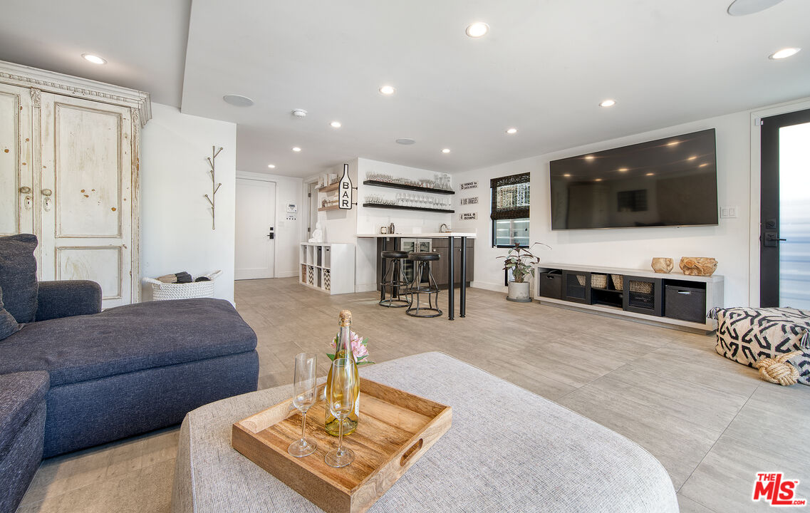 5317 Pacific Avenue Marina del Rey, CA 90292 - Photo 10 of 41 a living room with furniture and a flat screen tv
