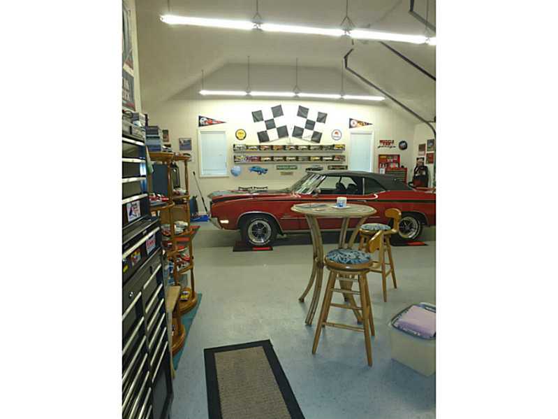 11 Waterman Farm Road Cumberland, RI 02864 - Photo 23 of 25 Parking Lot/Garage. Oversized third bay garage with plenty of storage and workshop area -- The ultimate mancave !