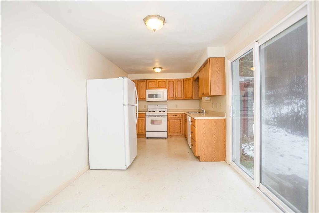 4335 West Pike Road Indiana, PA 15701 - Photo 14 of 37 a kitchen with a refrigerator a washer and dryer