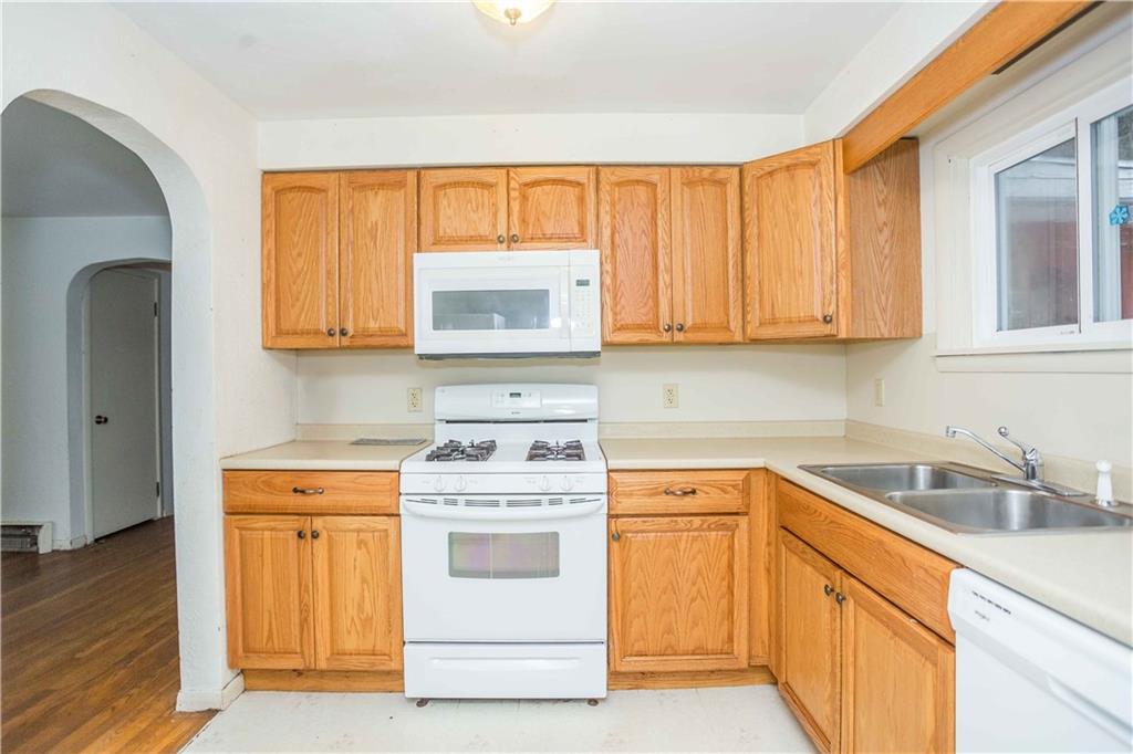 4335 West Pike Road Indiana, PA 15701 - Photo 18 of 37 a kitchen with stainless steel appliances granite countertop white cabinets sink and window
