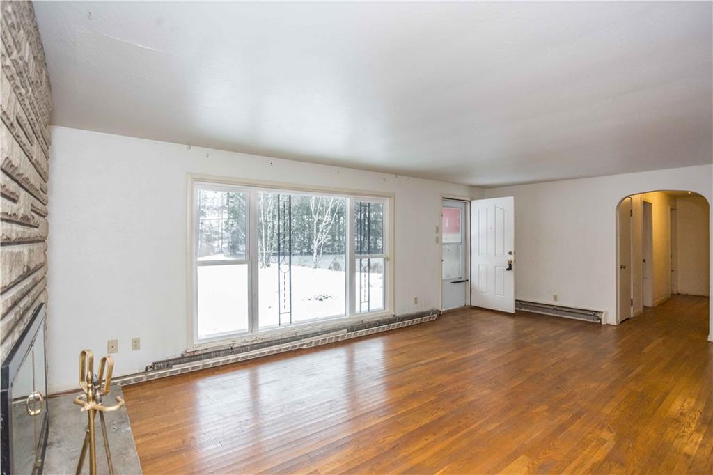 4335 West Pike Road Indiana, PA 15701 - Photo 21 of 37 an empty room with wooden floor and windows