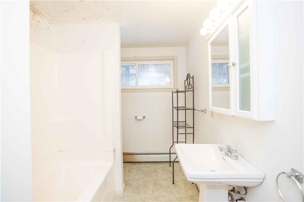 4335 West Pike Road Indiana, PA 15701 - Photo 23 of 37 a bathroom with a sink a toilet and shower