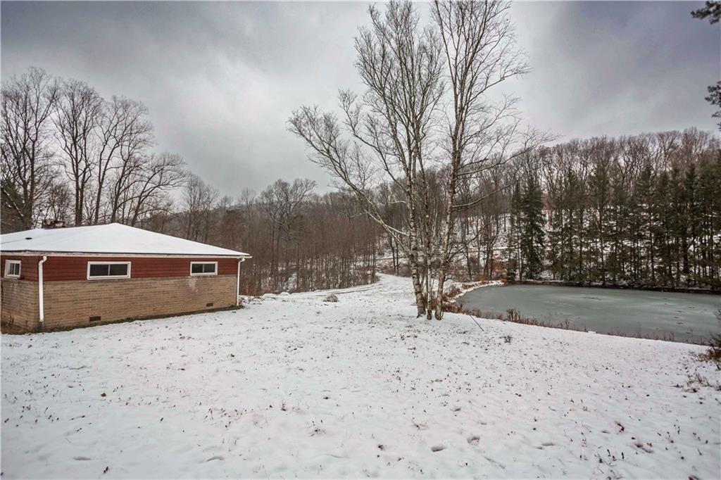 4335 West Pike Road Indiana, PA 15701 - Photo 33 of 37 a wooden bench sitting in middle of snow