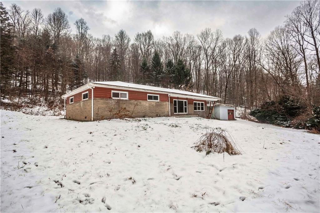 4335 West Pike Road Indiana, PA 15701 - Photo 4 of 37 a view of a house with a yard covered in snow