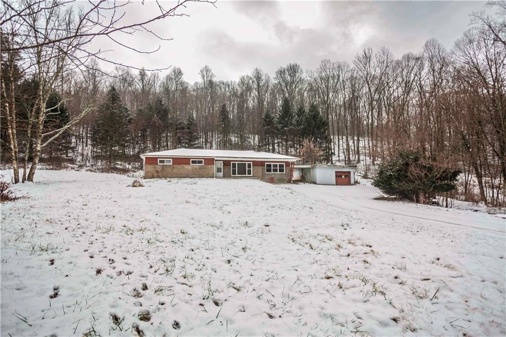 4335 West Pike Road Indiana, PA 15701 - Photo 5 of 37 a view of a backyard with snow on the road