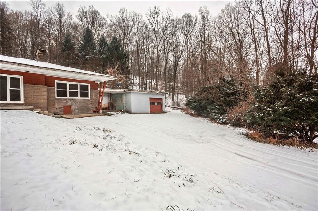 4335 West Pike Road Indiana, PA 15701 - Photo 6 of 37 a view of a house with a yard covered in snow
