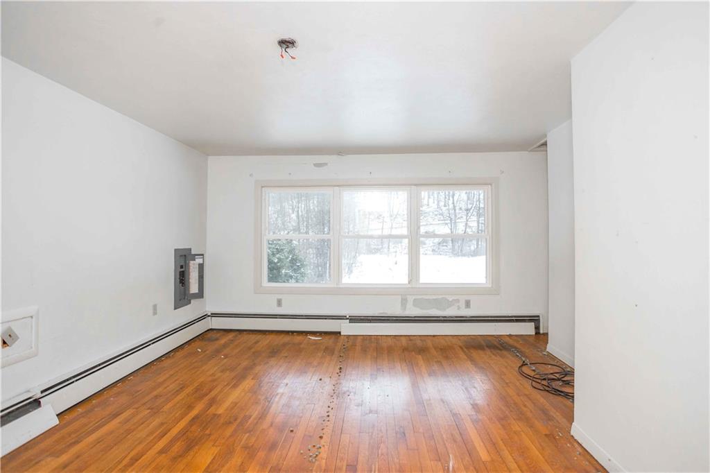 4335 West Pike Road Indiana, PA 15701 - Photo 10 of 37 an empty room with wooden floor and windows