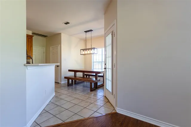 a view of dining room with furniture and a window