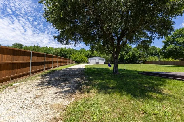 a view of a backyard with a garden