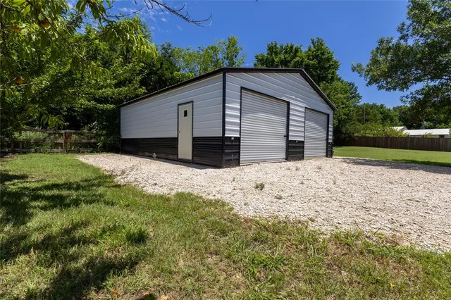 a view of a park and trees in the background