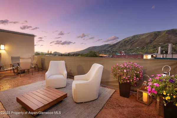 a view of a terrace with furniture