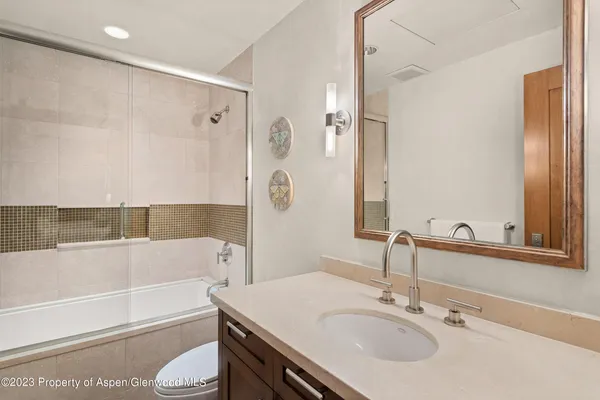 a bathroom with a sink a toilet and a bathtub