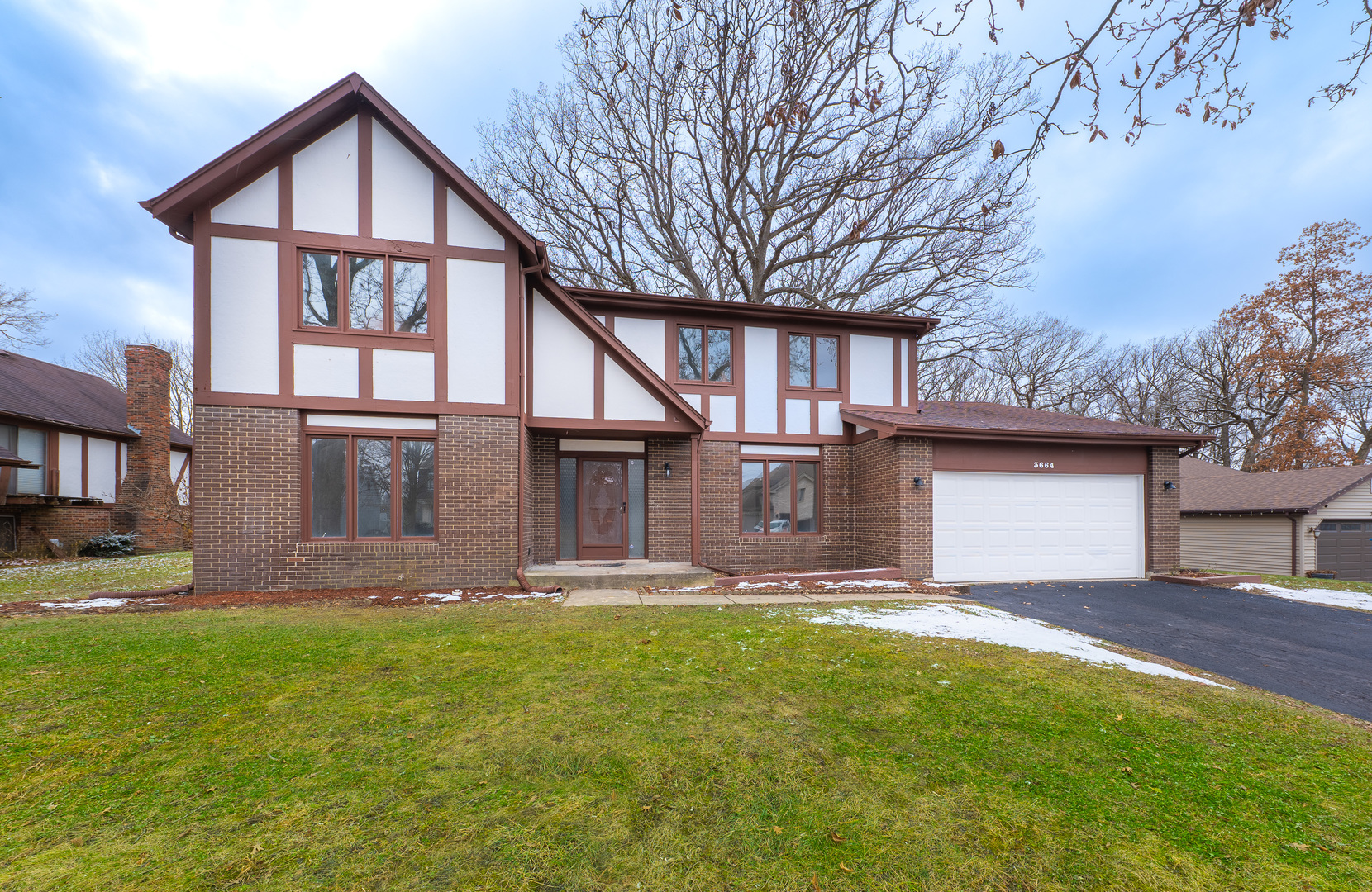 3664 Edward Drive Crete, IL 60417 - Photo 1 of 30 a front view of a house with a yard and garage