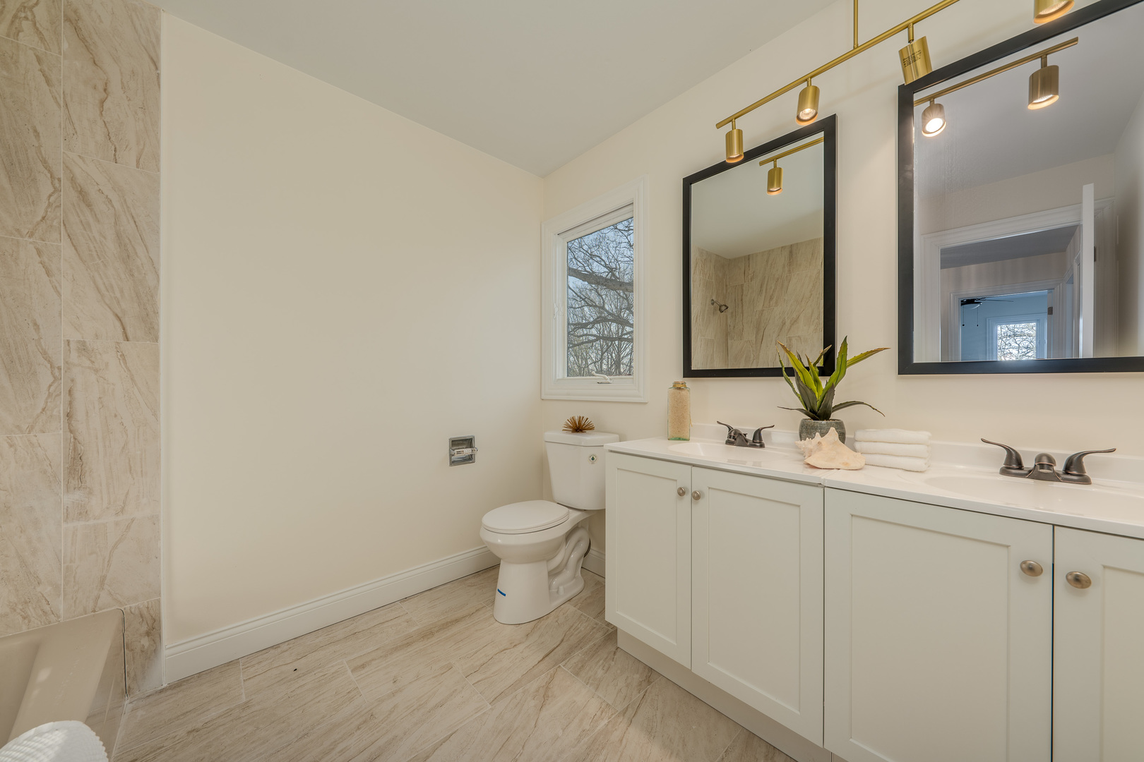 3664 Edward Drive Crete, IL 60417 - Photo 20 of 30 a bathroom with a toilet a sink and mirror