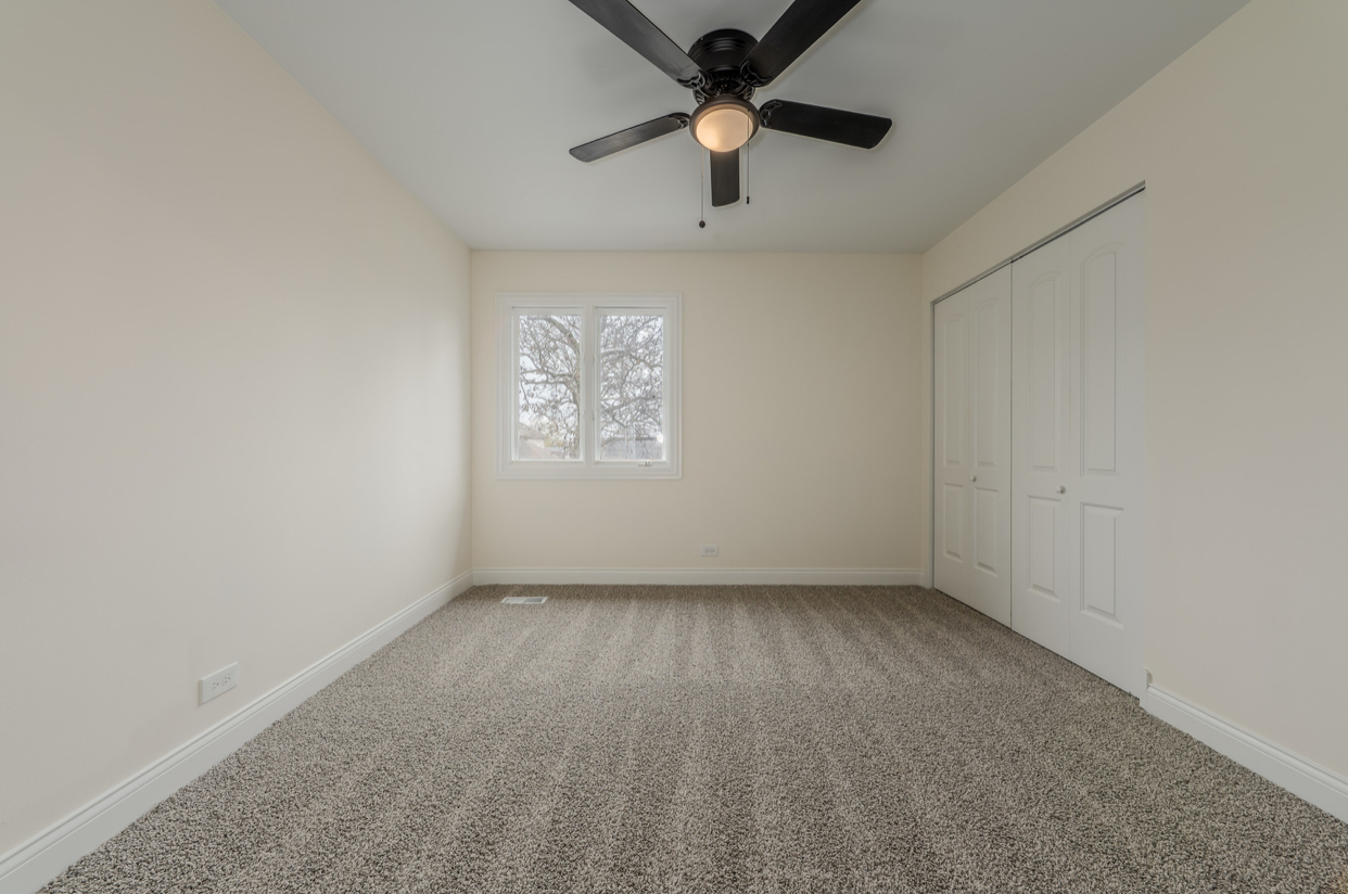 3664 Edward Drive Crete, IL 60417 - Photo 21 of 30 an empty room with a window and a fan