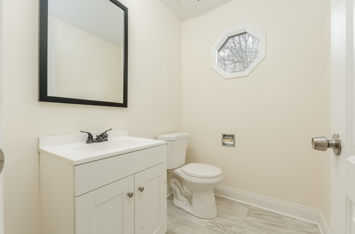3664 Edward Drive Crete, IL 60417 - Photo 8 of 30 a bathroom with a toilet sink and mirror