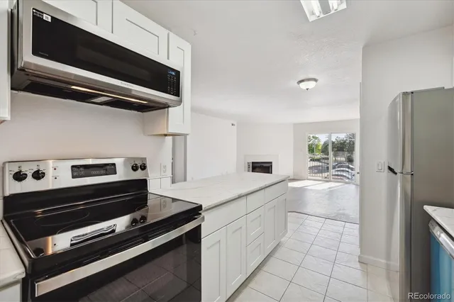 a kitchen with a stove and a microwave