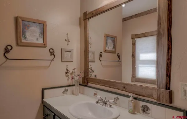 a bedroom with double bed and a window