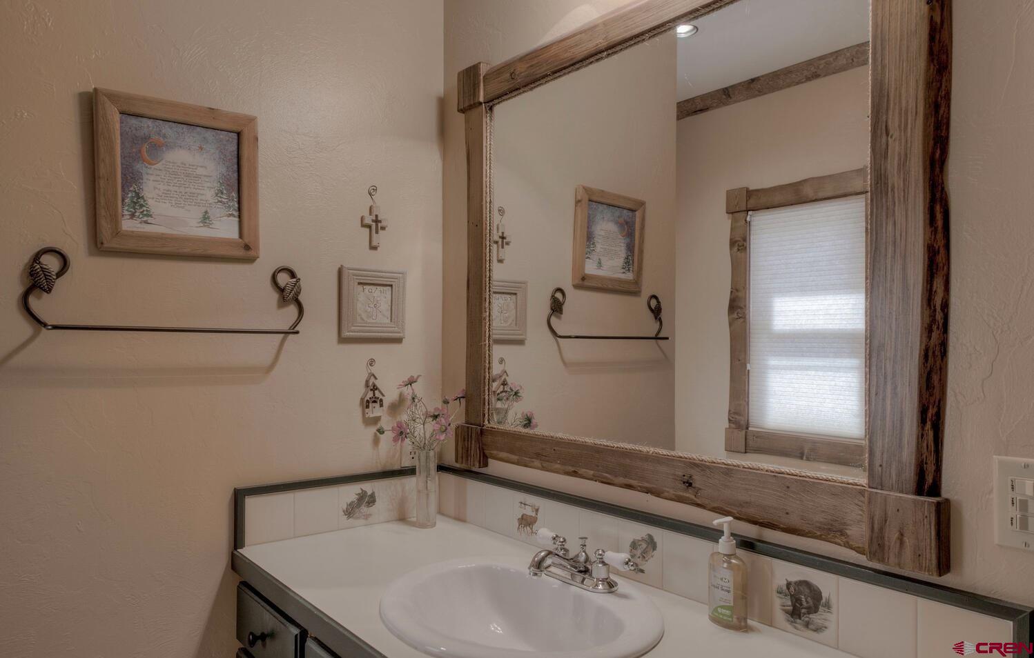 1499 Lake County Road Twin Lakes, CO 81251 - Photo 19 of 37 a bathroom with a sink and a mirror