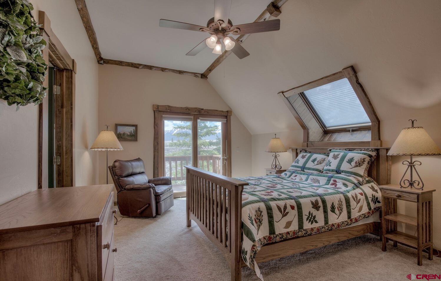1499 Lake County Road Twin Lakes, CO 81251 - Photo 23 of 37 a bedroom with a bed couch and window