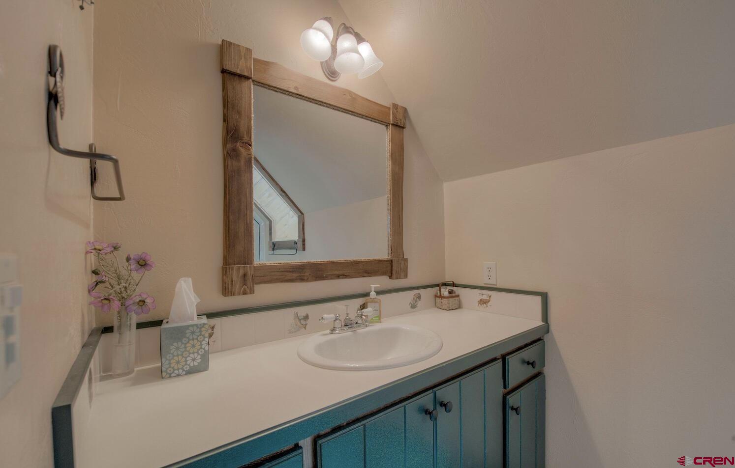 1499 Lake County Road Twin Lakes, CO 81251 - Photo 24 of 37 a bathroom with a sink and a mirror