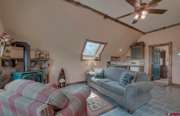 a view of a house with a yard and sitting area