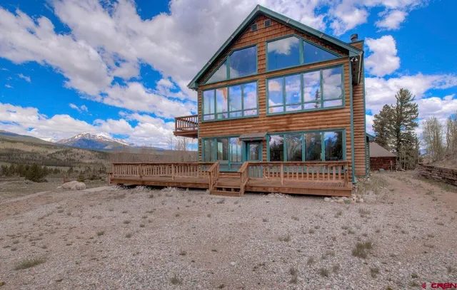 a view of a balcony with wooden fence