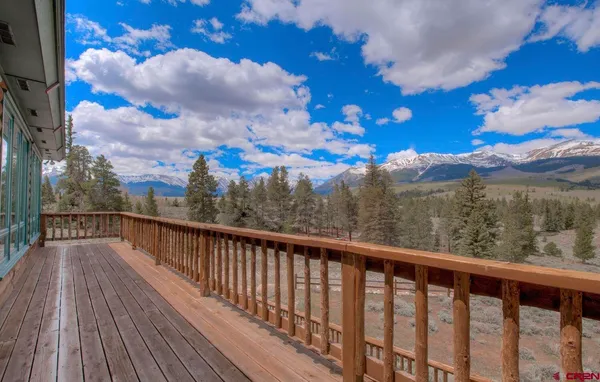 a kitchen with granite countertop a refrigerator and a sink
