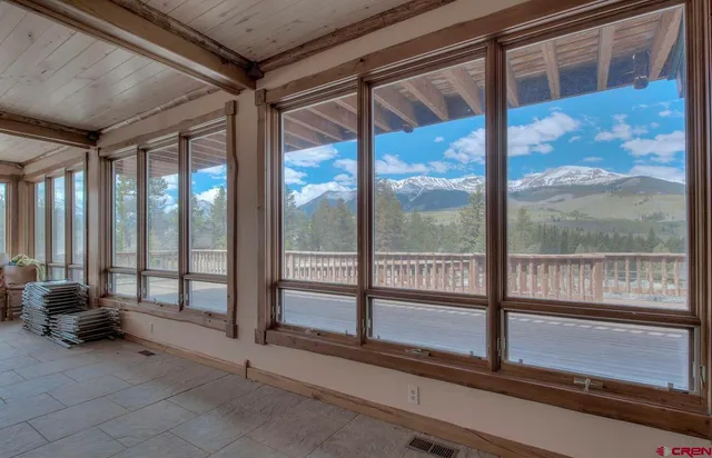 a view of an empty room with windows