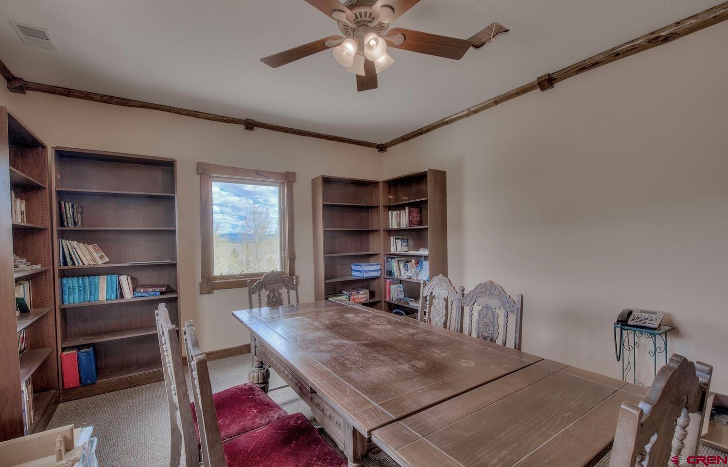 1499 Lake County Road Twin Lakes, CO 81251 - Photo 36 of 37 a room with furniture and a book shelf