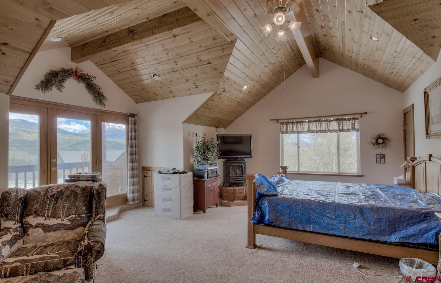 1499 Lake County Road Twin Lakes, CO 81251 - Photo 7 of 37 a bedroom with furniture and large windows
