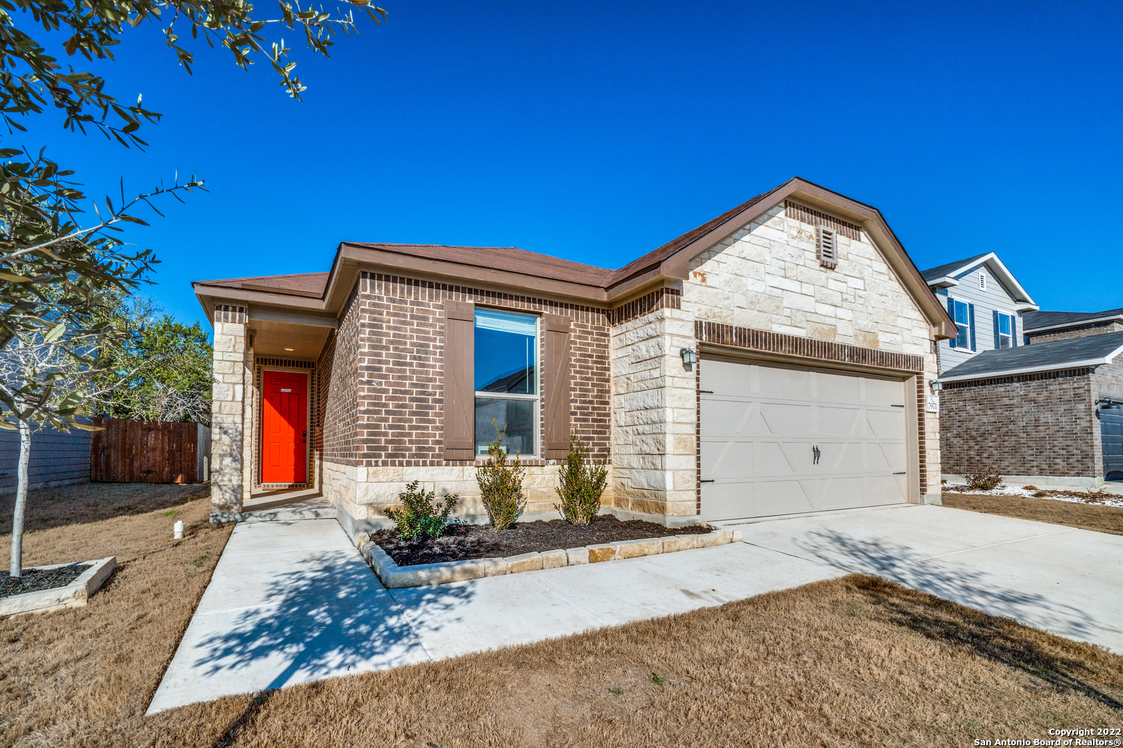 a front view of a house with garden