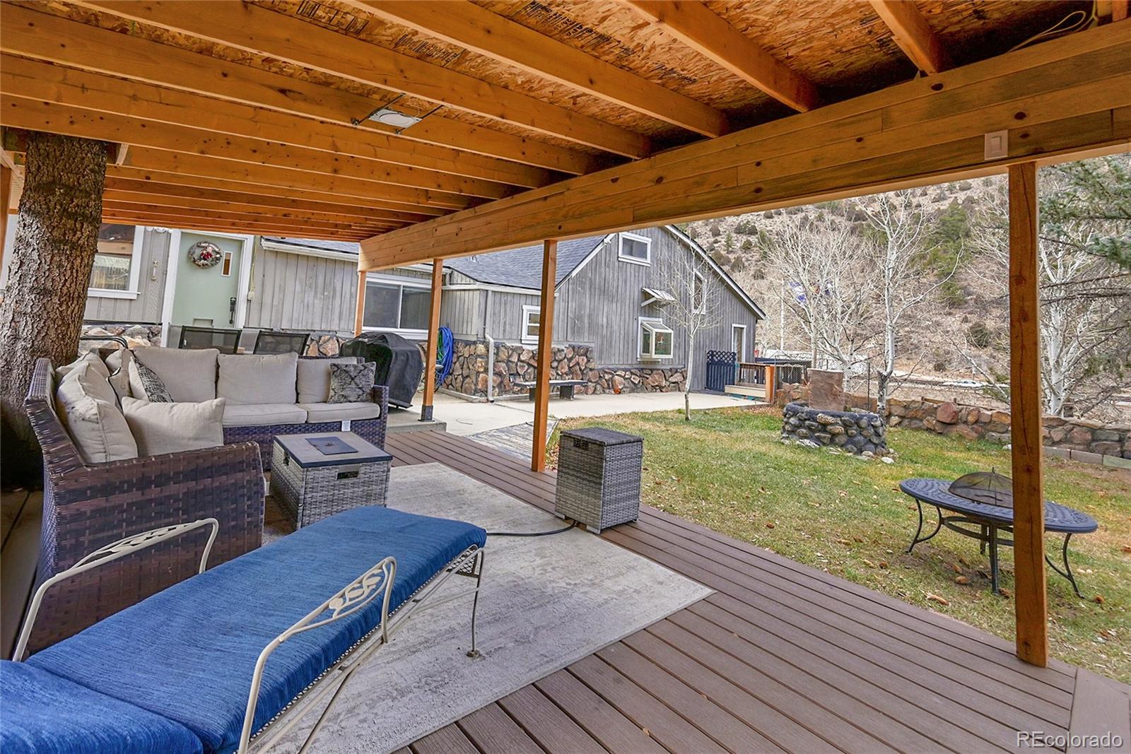 3645 Stanley Road Dumont, CO 80436 - Photo 23 of 39 a living room with couch and a table and chairs